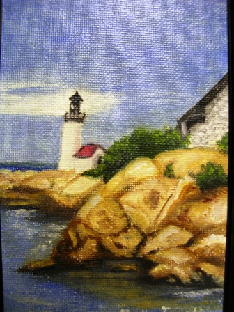 [     Lighthouse and rocks  ovel     ]